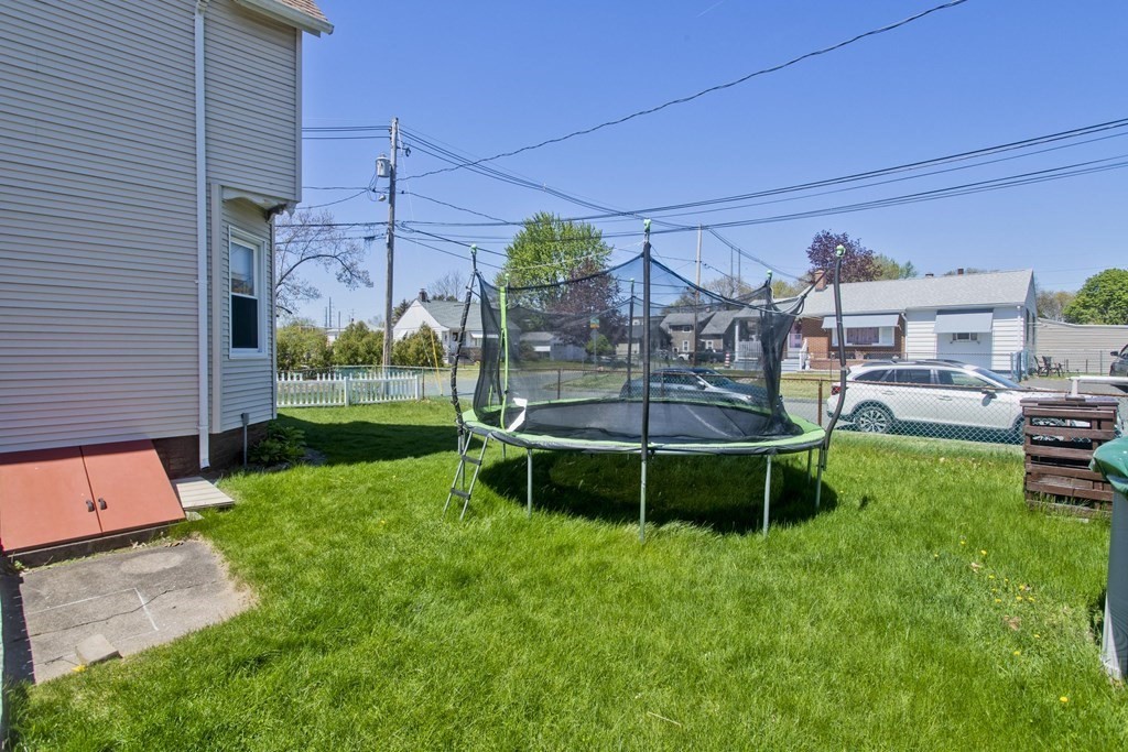 4 Laurel Street Chicopee, MA 01020 - Photo 33 of 35 a view of a chair and table in backyard of the house