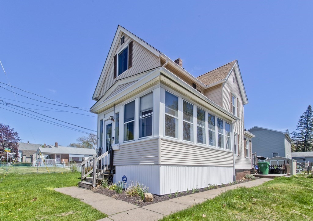 4 Laurel Street Chicopee, MA 01020 - Photo 35 of 35 a front view of a house with a yard