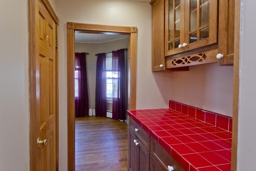 4 Laurel Street Chicopee, MA 01020 - Photo 6 of 35 a living room with a bed and furniture