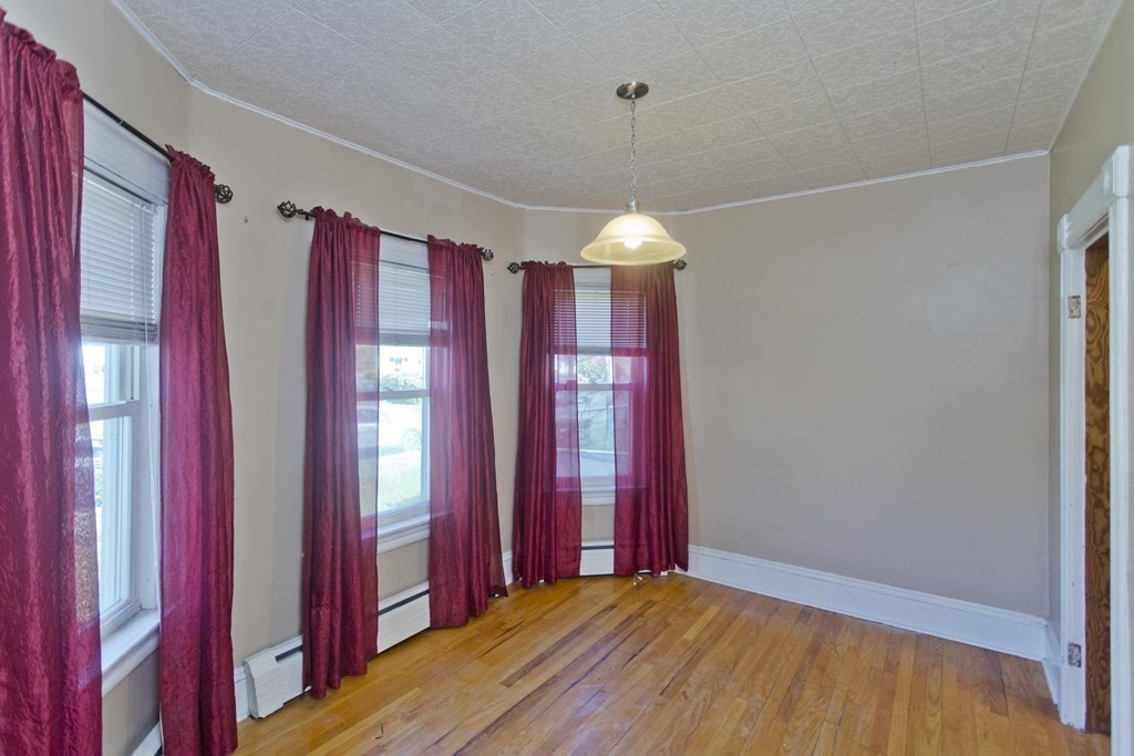 4 Laurel Street Chicopee, MA 01020 - Photo 8 of 35 a view of a room with window and stairs