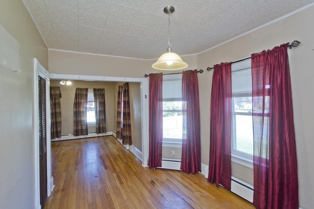 4 Laurel Street Chicopee, MA 01020 - Photo 9 of 35 a view of a room with wooden floor and a window