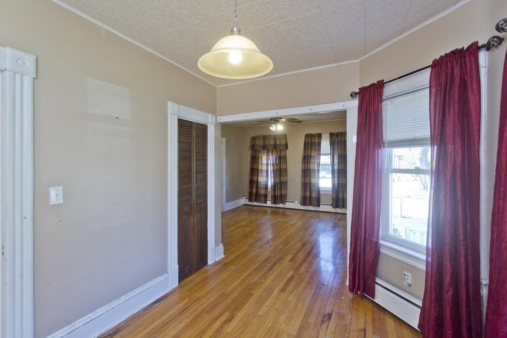 4 Laurel Street Chicopee, MA 01020 - Photo 10 of 35 a view of a room with wooden floor and door