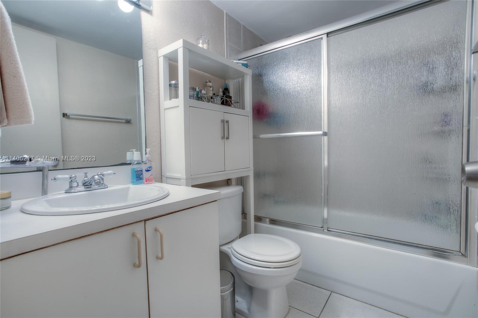17530 Northwest 68th Avenue, Unit C3010 Hialeah, FL 33015 - Photo 11 of 15 a bathroom with a sink toilet and shower