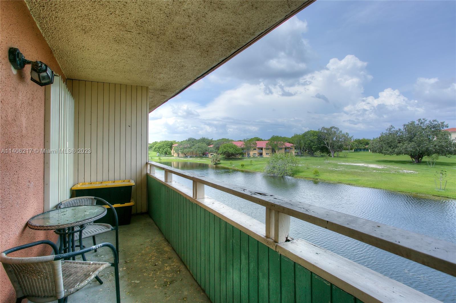 17530 Northwest 68th Avenue, Unit C3010 Hialeah, FL 33015 - Photo 12 of 15 a view of swimming pool from a balcony