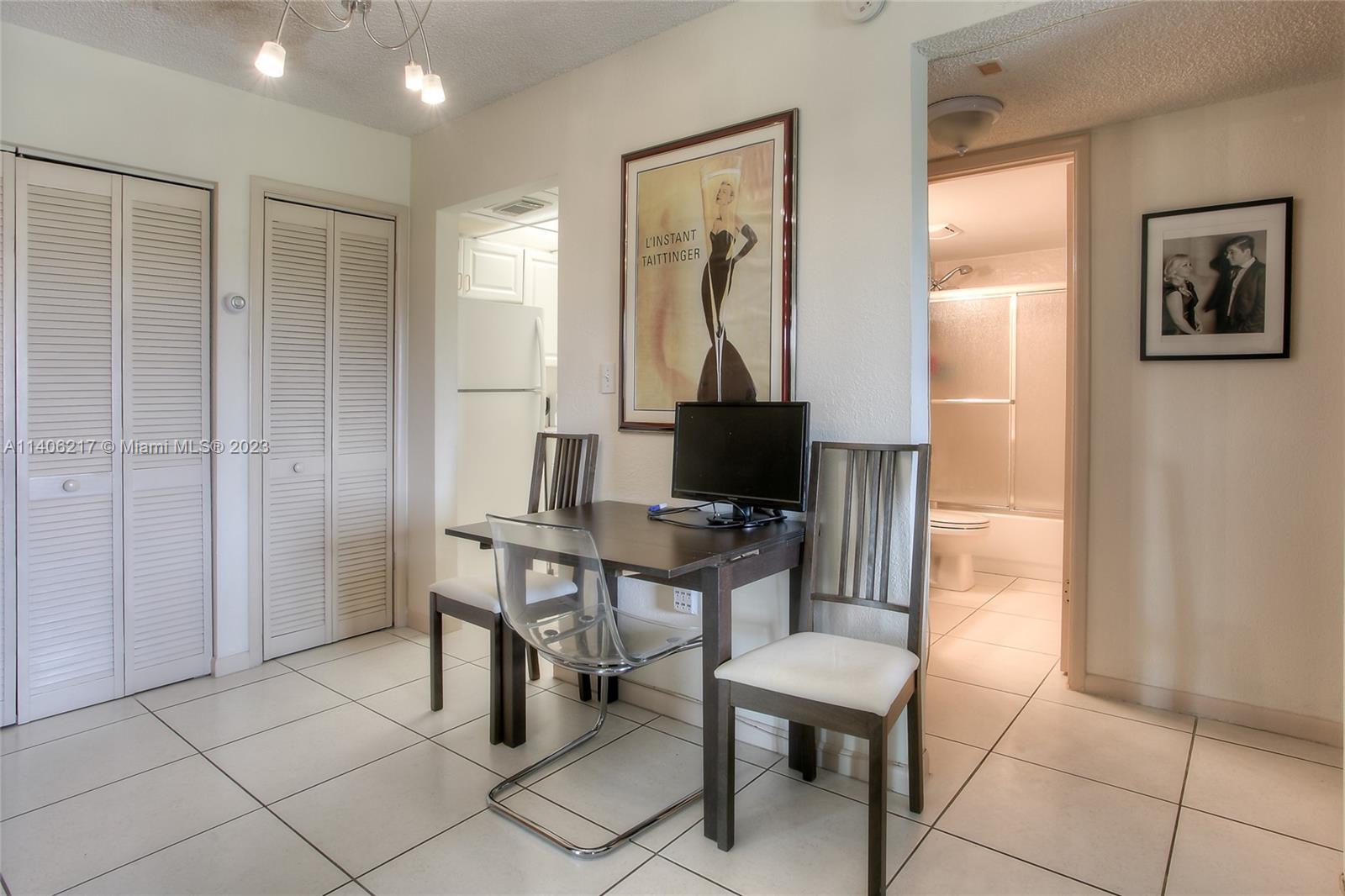 17530 Northwest 68th Avenue, Unit C3010 Hialeah, FL 33015 - Photo 6 of 15 a workspace with furniture and a window