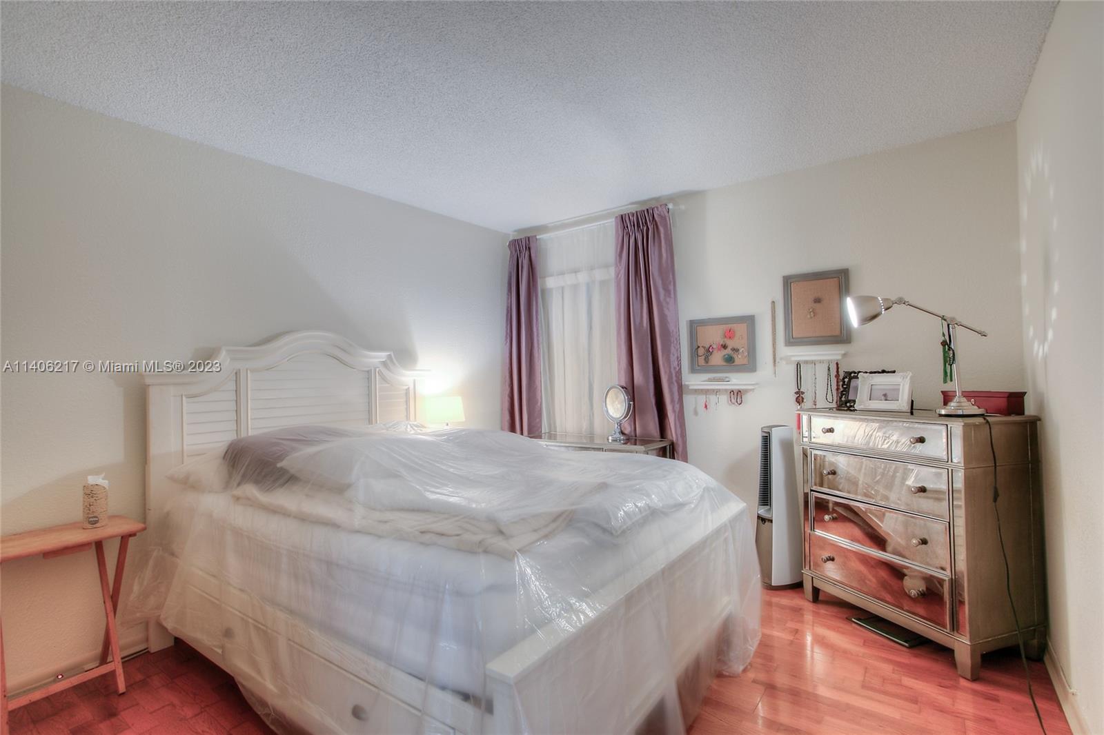 17530 Northwest 68th Avenue, Unit C3010 Hialeah, FL 33015 - Photo 9 of 15 a bedroom with a bed and a closet