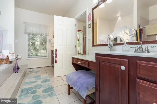 a bedroom with a bed and flat screen tv