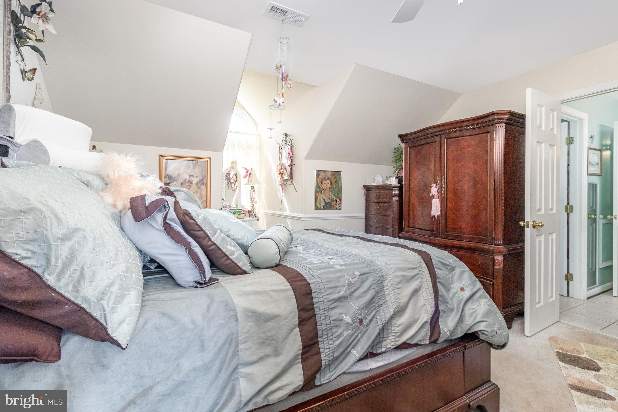 13467 Ellis Way King George, VA 22485 - Photo 38 of 81 a bedroom with a bed a closet and a large mirror