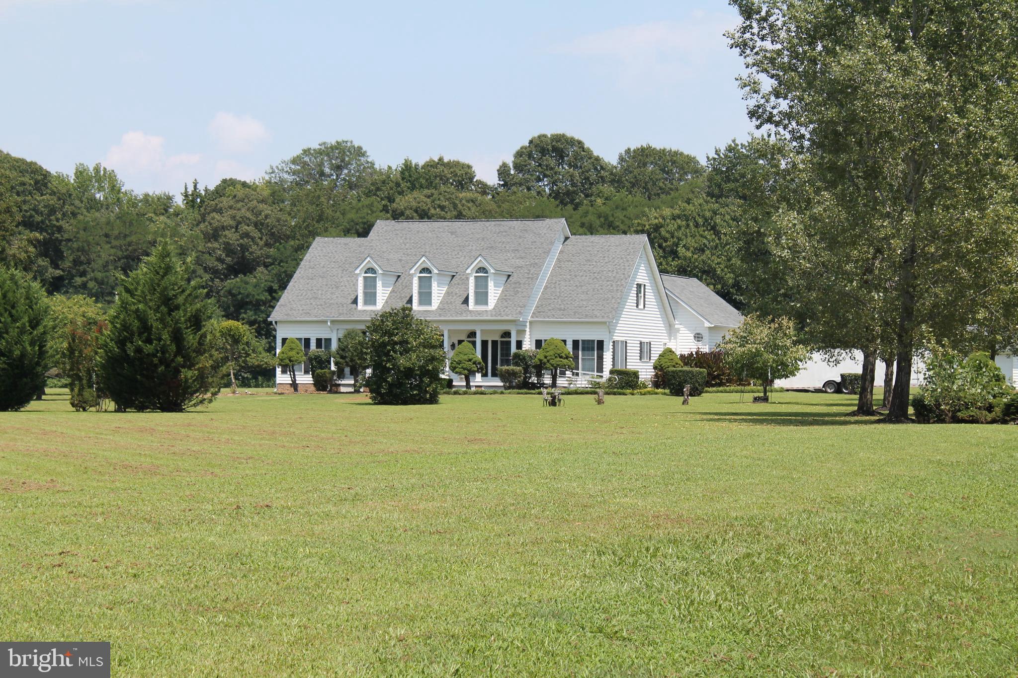 13467 Ellis Way King George, VA 22485 - Photo 65 of 81 a front view of a house with a garden and trees
