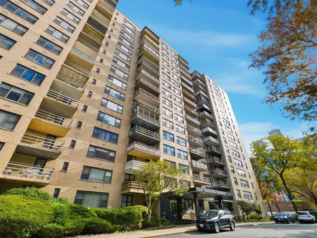 a view of a buildings with a street