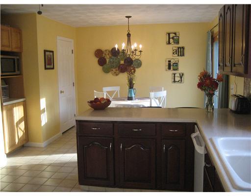 15 Arrowwood Road Coventry, RI 02816 - Photo 7 of 18 Kitchen. A PARTIAL ALTERNATE VIEW,LOTS OF CABINET SPACE, A PANTRY CLOSET TOO