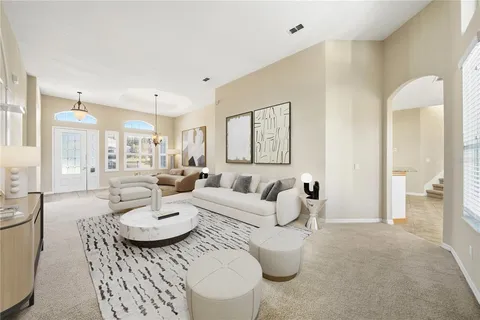 a kitchen with stainless steel appliances granite countertop a refrigerator sink and stove