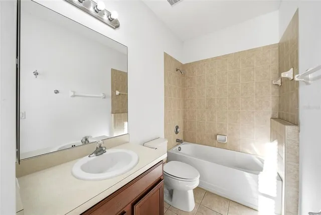 an aerial view of a house with a yard lake view