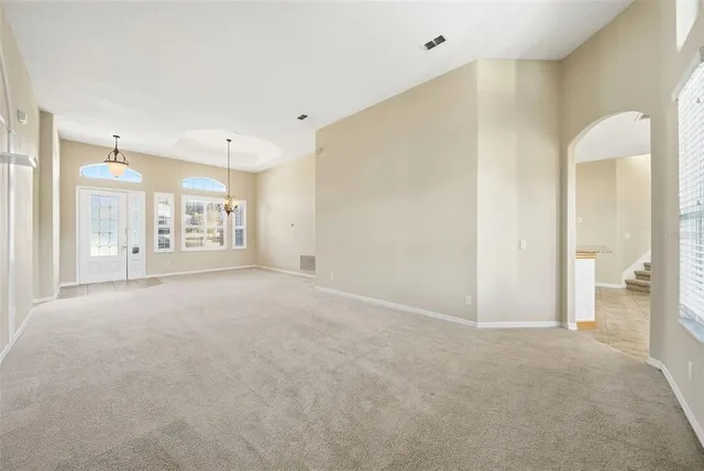 a kitchen with stainless steel appliances granite countertop a refrigerator a stove top oven a sink and dishwasher