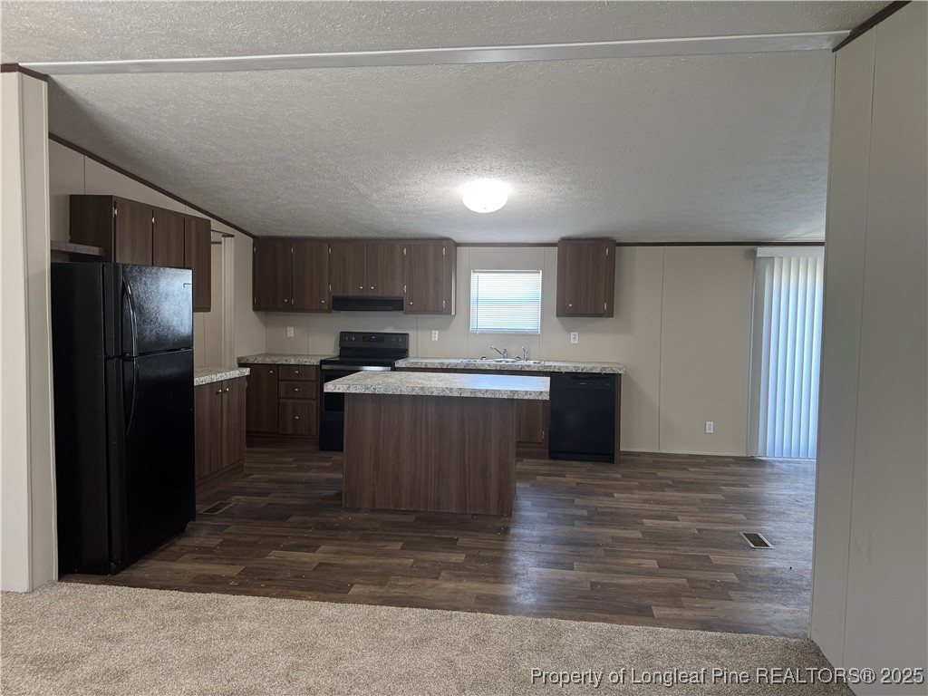93 Westbrook Road Clinton, NC 28328 - Photo 9 of 26 a kitchen with a refrigerator and a sink