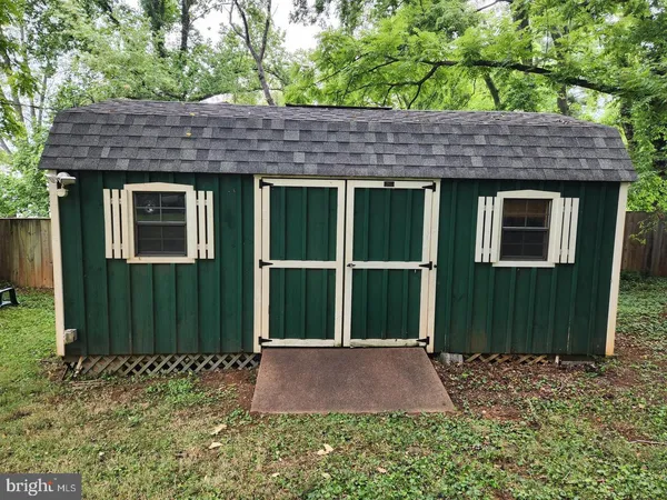 a view of a park with large trees