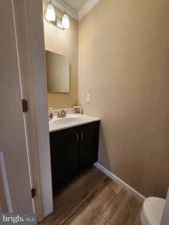 a vase of flowers sitting on a floor