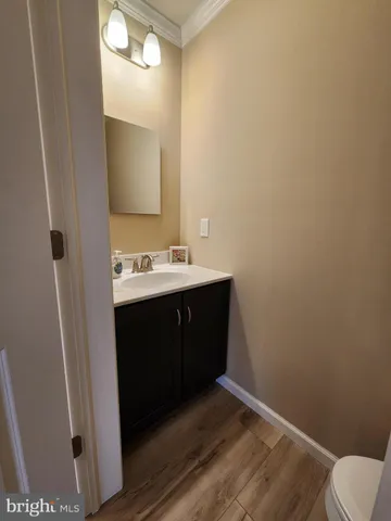 a vase of flowers sitting on a floor