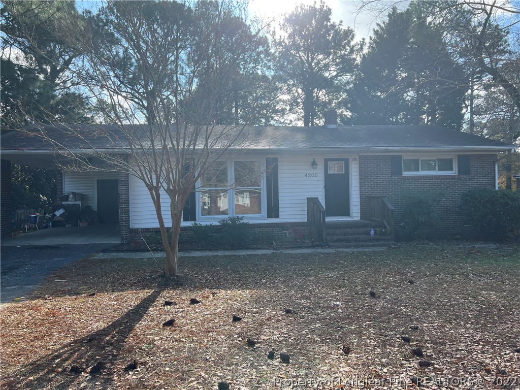 4205 Coventry Road Fayetteville, NC 28304 - Photo 1 of 2 a view of a house with a yard