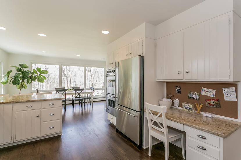 17 Miller Road Darien, CT 06820 - Photo 6 of 21 a kitchen with granite countertop a refrigerator a sink a stove and white cabinets