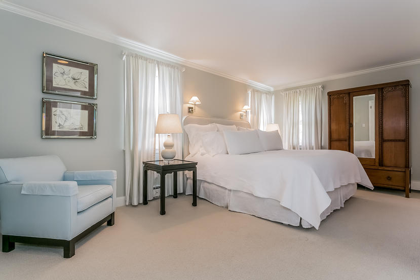 17 Miller Road Darien, CT 06820 - Photo 10 of 21 a bedroom with a bed couches chair and wall painting