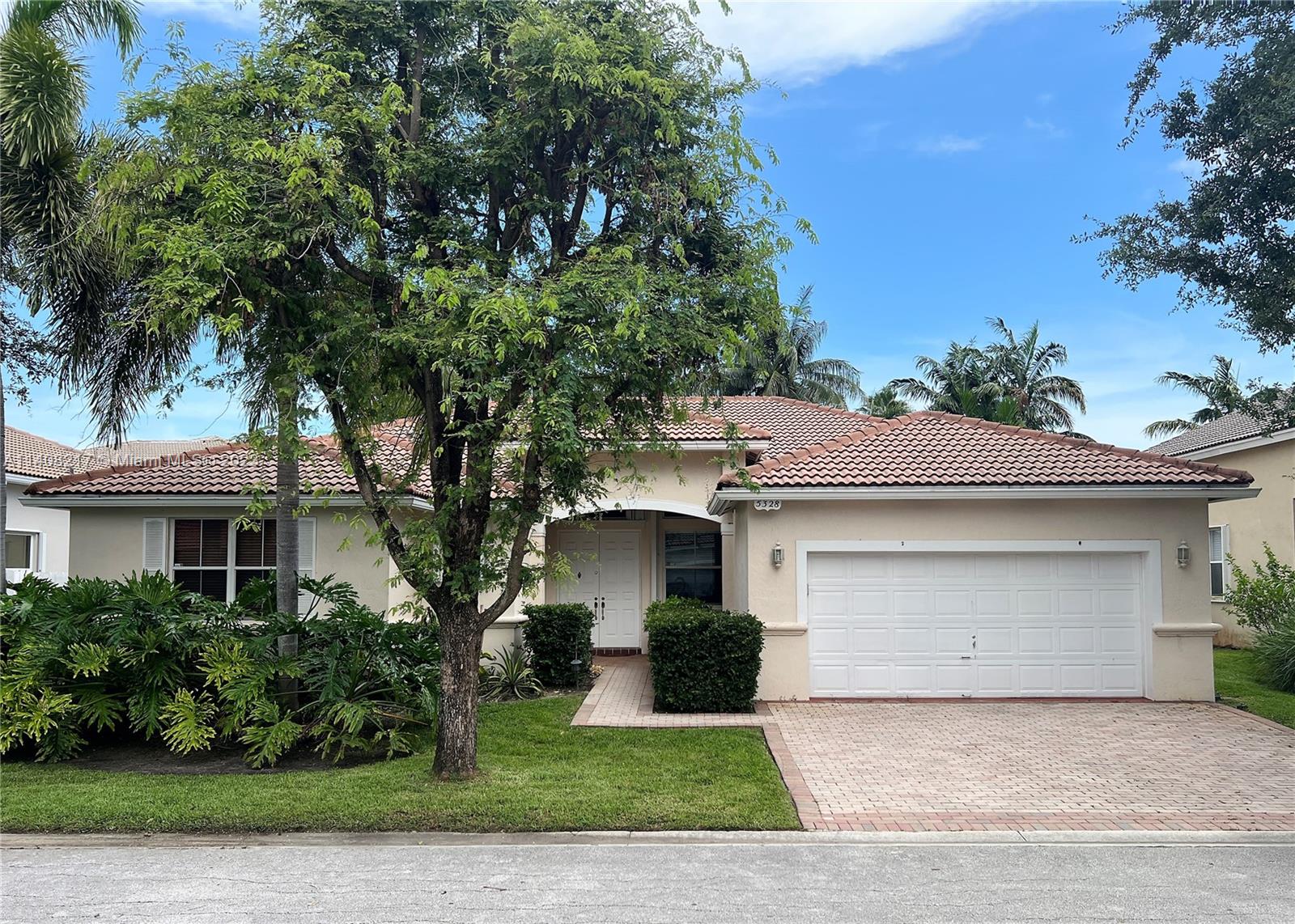 Oakridge Hollywood, FL 33312 - Photo 1 of 33 a front view of a house with a garden and plants