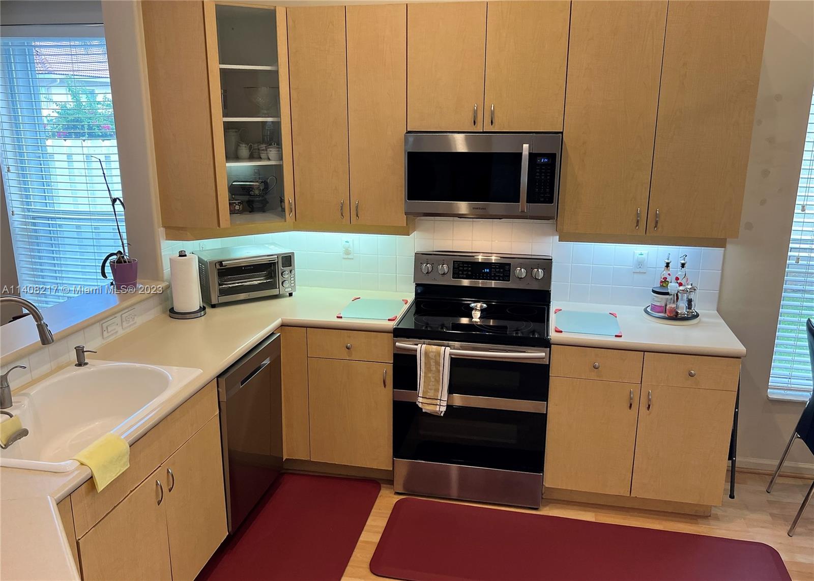 Oakridge Hollywood, FL 33312 - Photo 14 of 33 a kitchen with a sink and a stove top oven