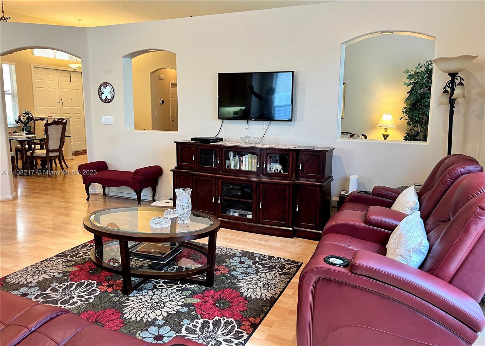 Oakridge Hollywood, FL 33312 - Photo 15 of 33 a living room with furniture and a flat screen tv