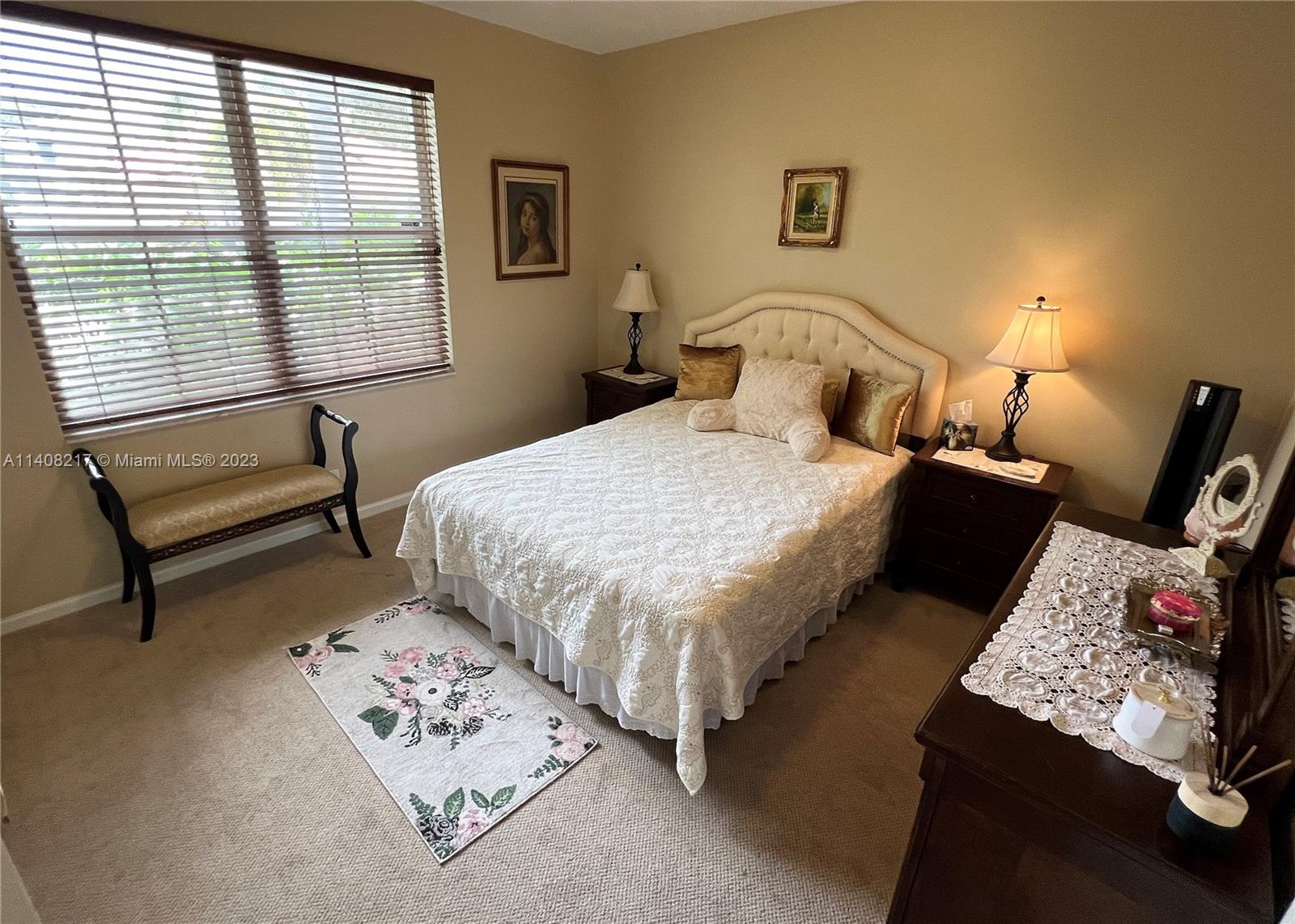 Oakridge Hollywood, FL 33312 - Photo 20 of 33 a bedroom with a bed a couch and a window