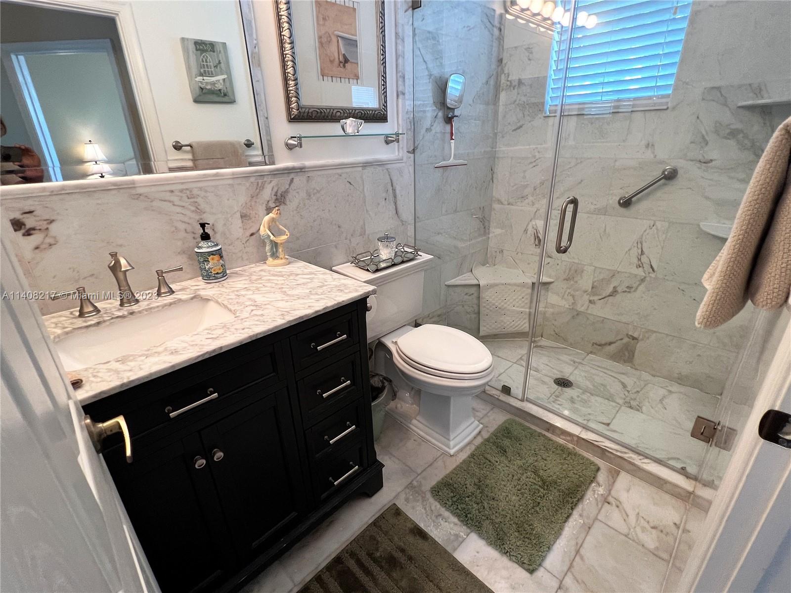 Oakridge Hollywood, FL 33312 - Photo 21 of 33 a bathroom with a sink and a mirror