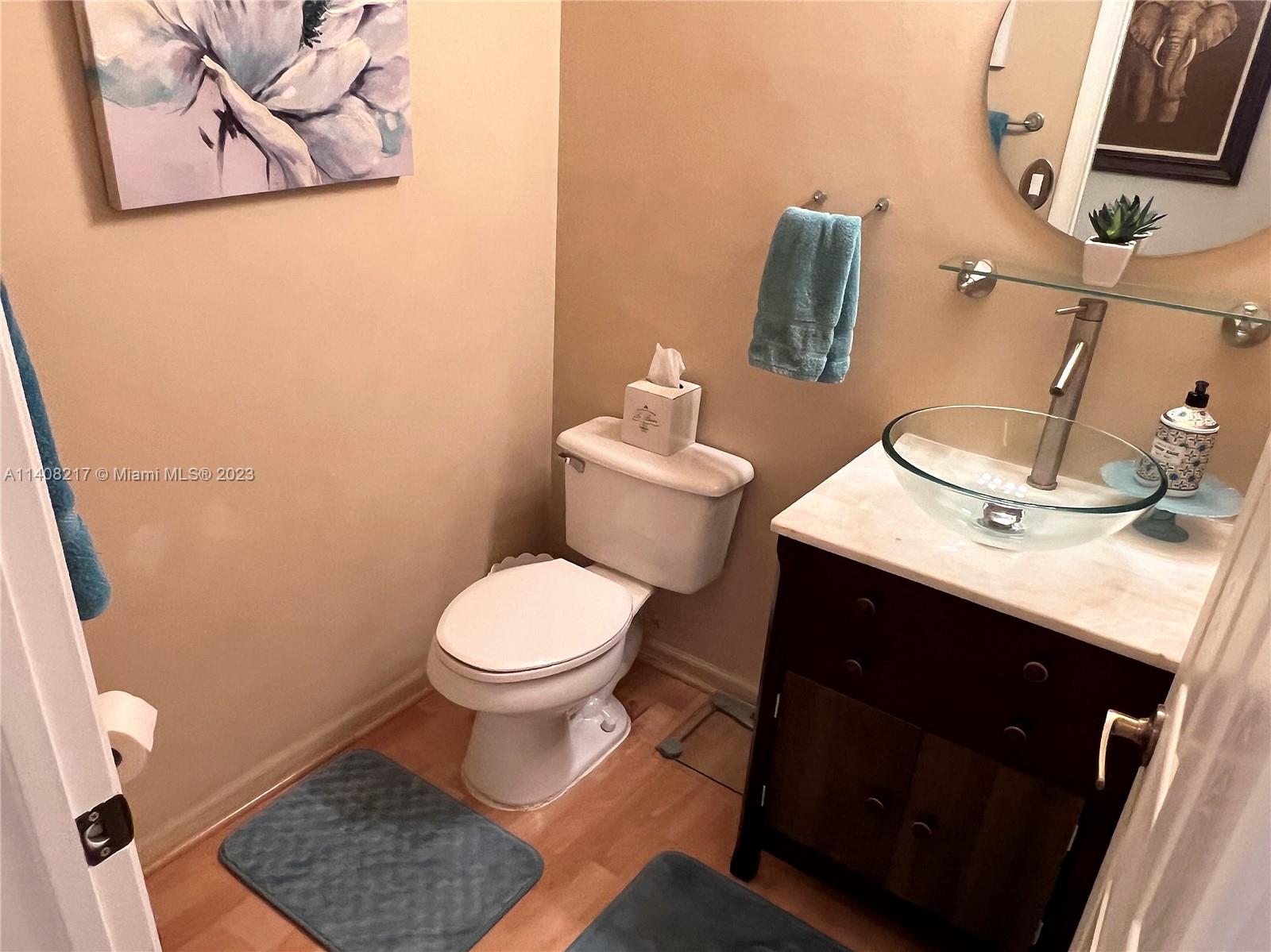 Oakridge Hollywood, FL 33312 - Photo 22 of 33 a bathroom with a sink and a toilet