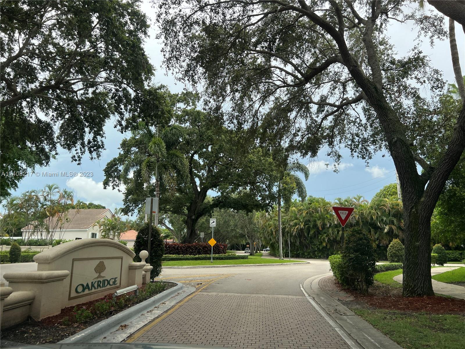 Oakridge Hollywood, FL 33312 - Photo 27 of 33 a street view with couple of cars parked on road