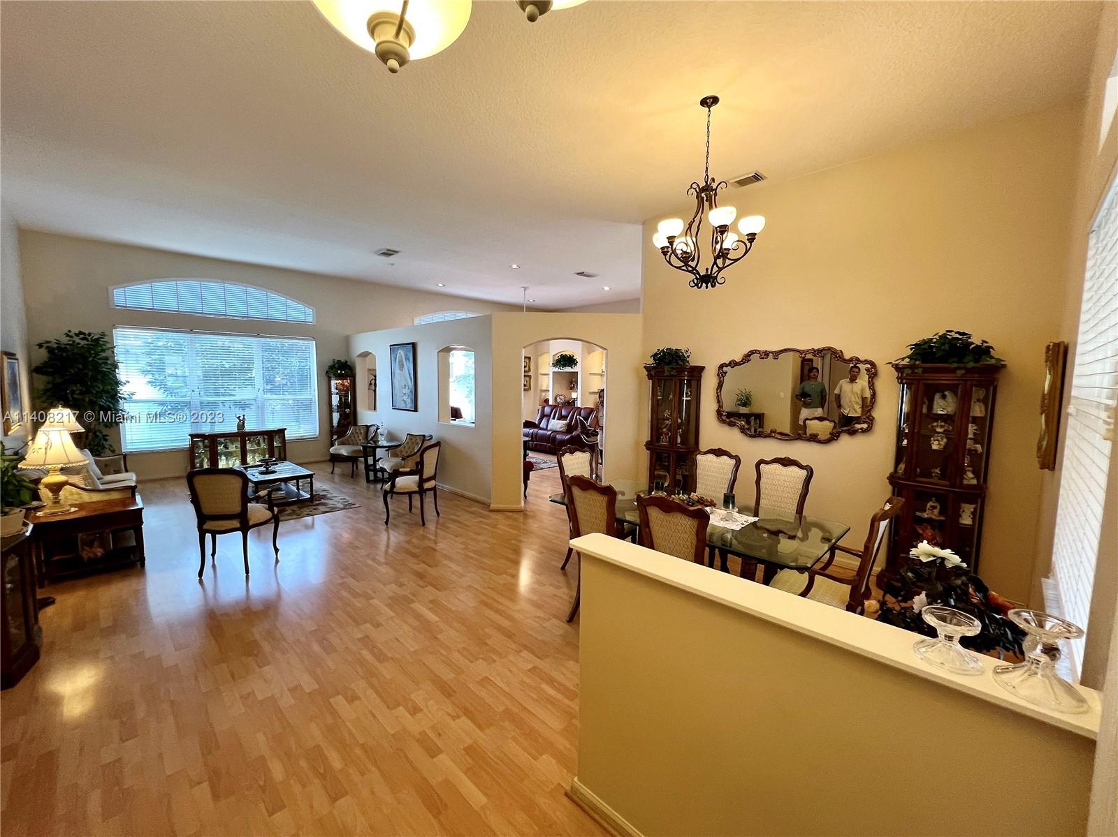 Oakridge Hollywood, FL 33312 - Photo 8 of 33 a view of a dining room with furniture window and wooden floor