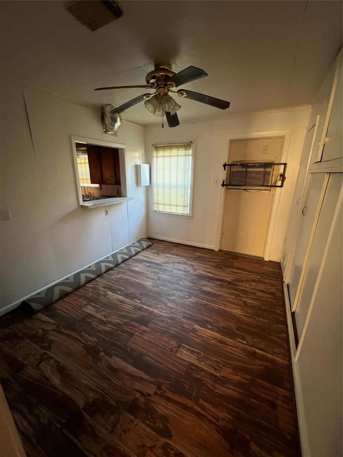 7358 Forrestal Street Houston, TX 77033 - Photo 11 of 25 a view of an empty room with a window and a fireplace