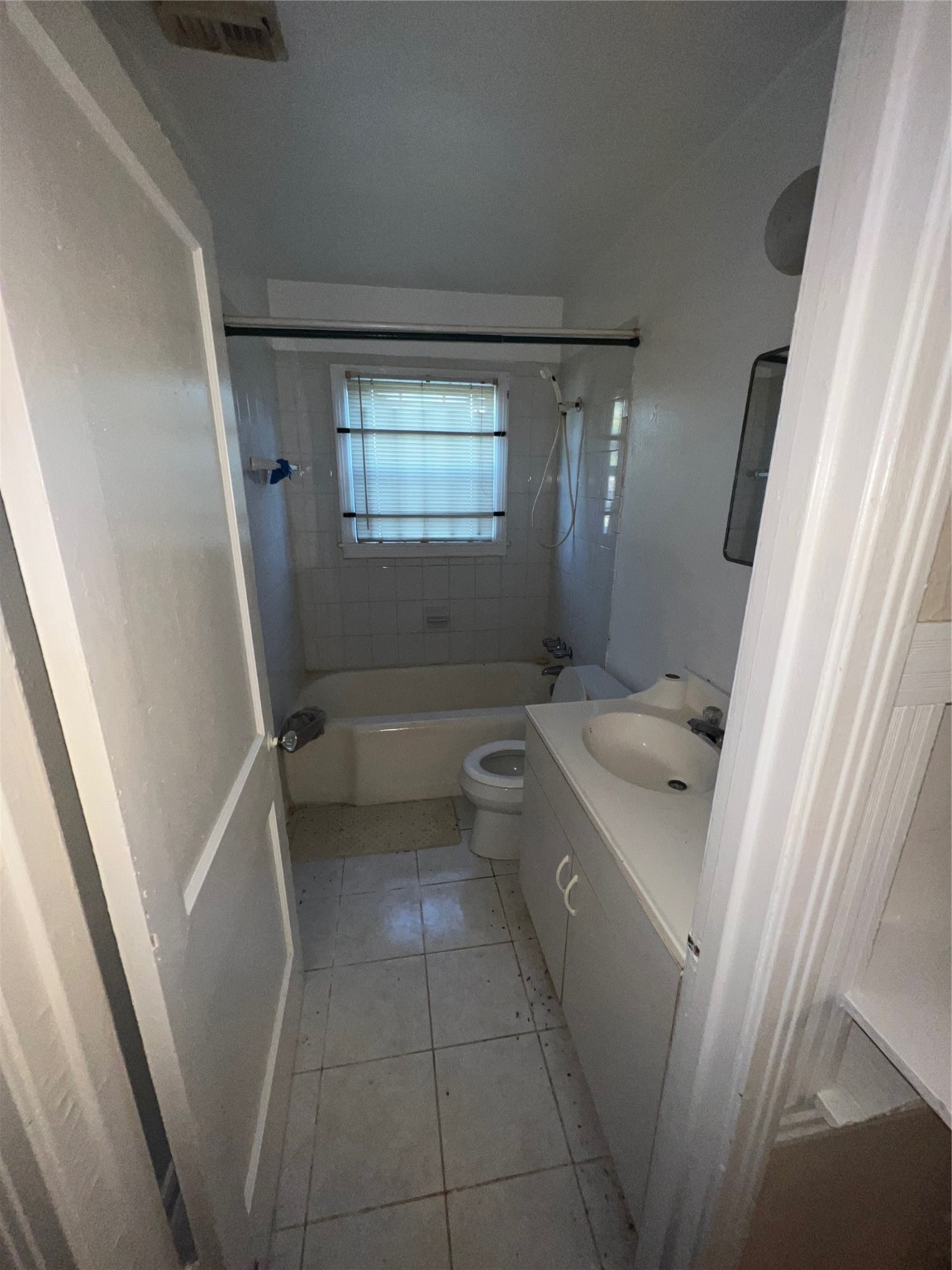 7358 Forrestal Street Houston, TX 77033 - Photo 14 of 25 a bathroom with a granite countertop sink toilet and shower