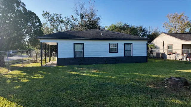 a view of a swimming pool with a yard