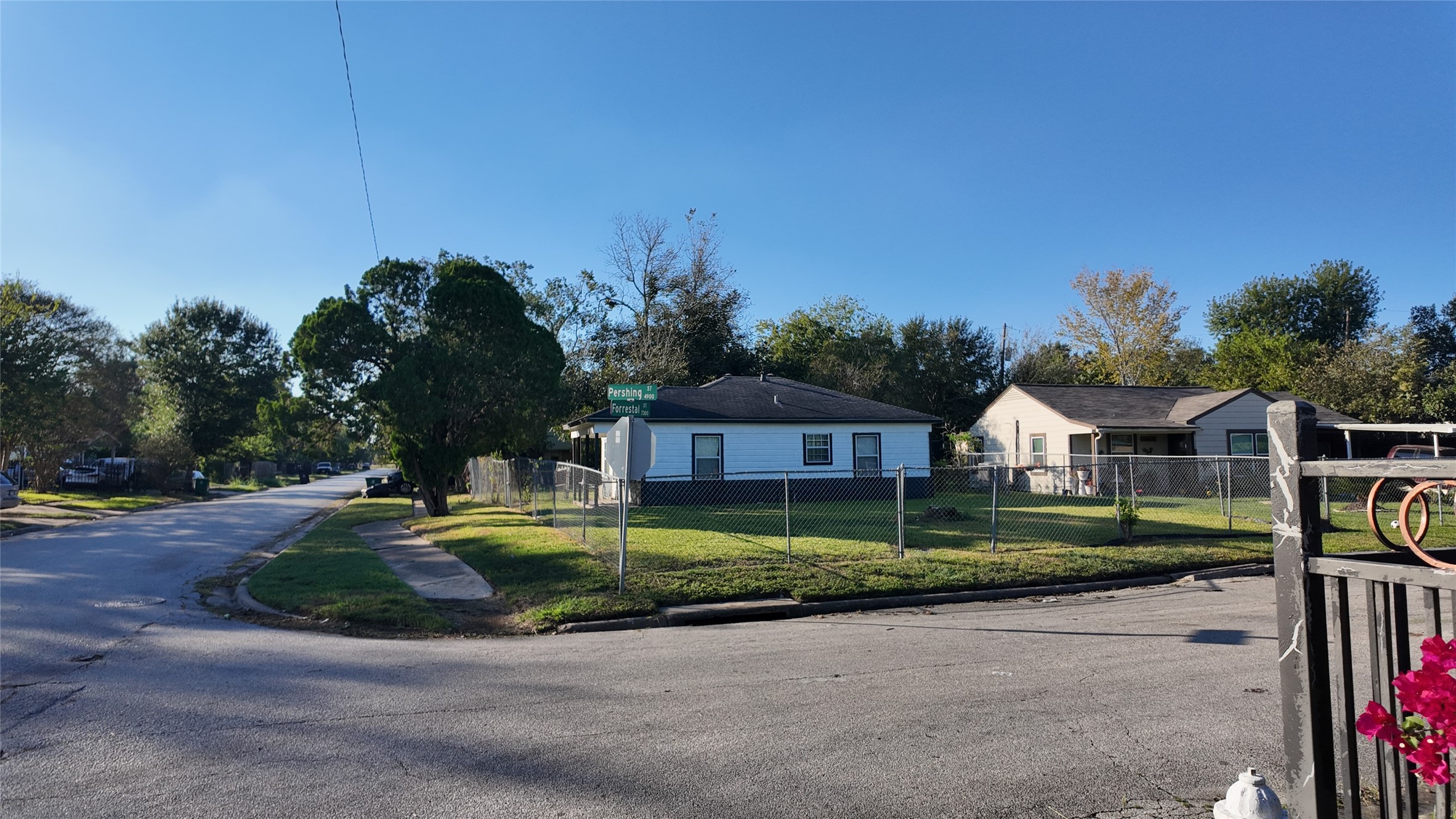 7358 Forrestal Street Houston, TX 77033 - Photo 21 of 25 a front view of a house with a yard