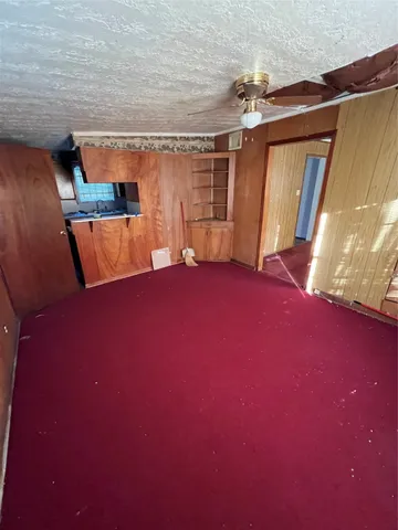 a view of empty room with front door