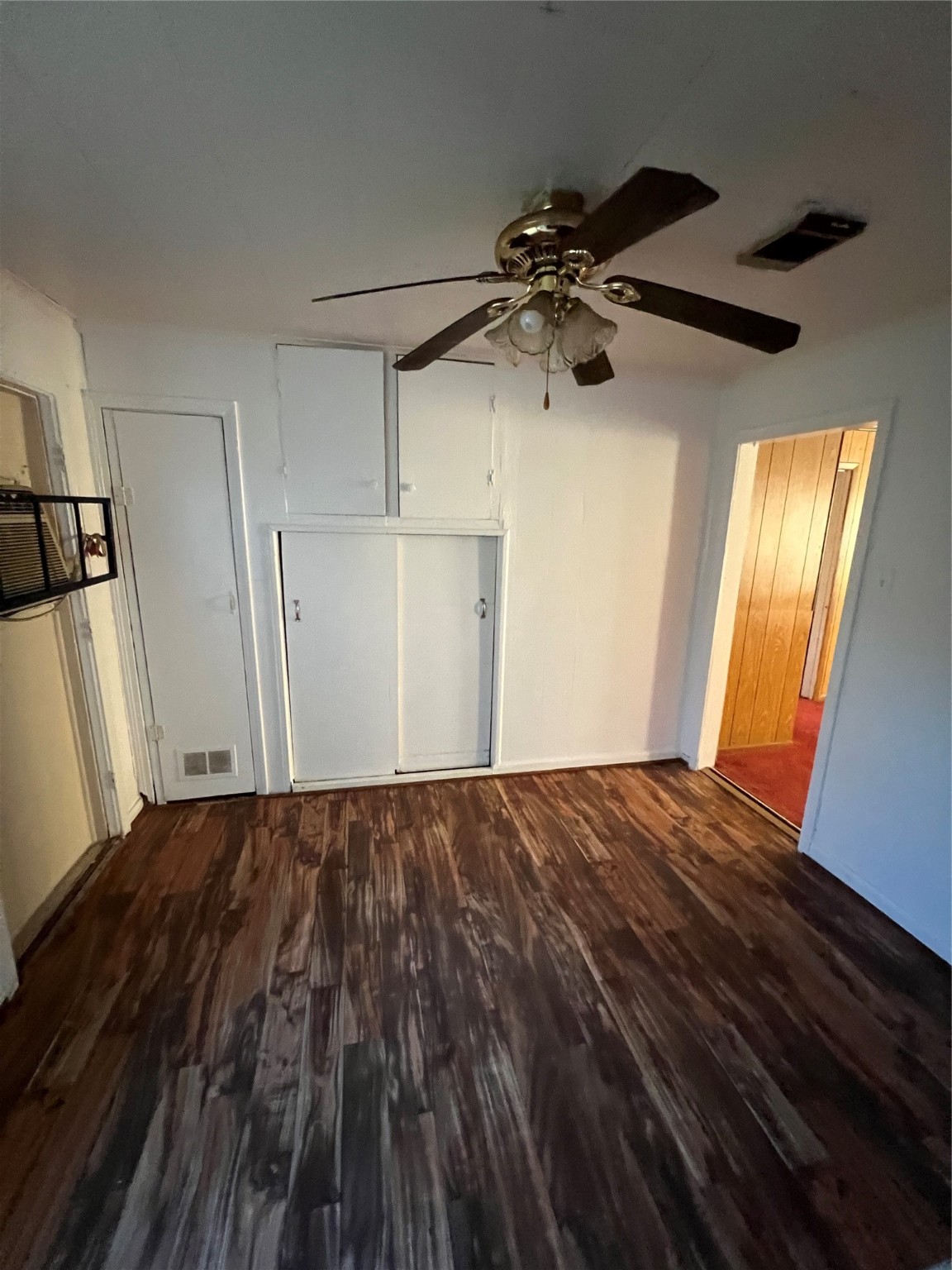7358 Forrestal Street Houston, TX 77033 - Photo 9 of 25 a view of empty room with wooden floor and fan