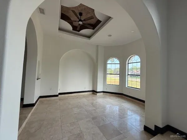 a view of entryway with a fireplace and window