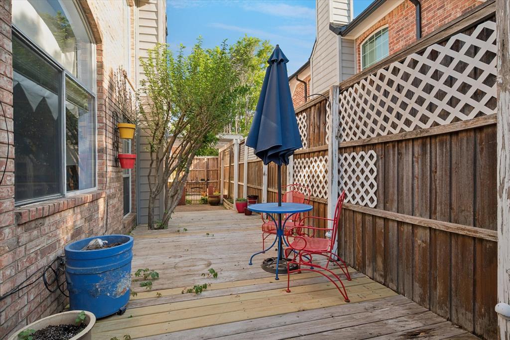14592 Greenleaf Court Addison, TX 75001 - Photo 23 of 30 a view of a chairs and table on the wooden floor