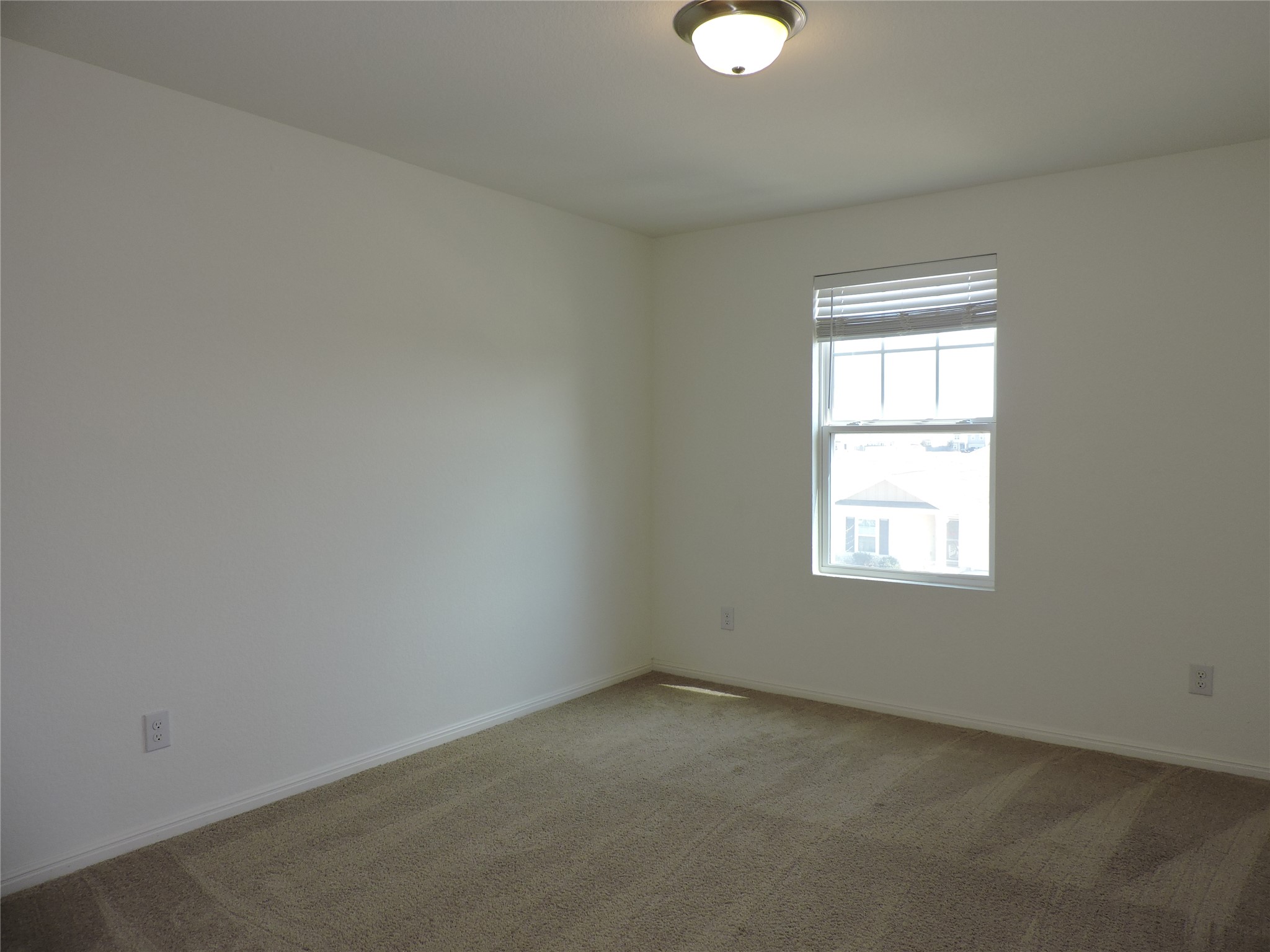 14120 Jeannette Rankin Rd Manor Manor, TX 78653 - Photo 20 of 25 Unfurnished room featuring carpet floors and baseboards
