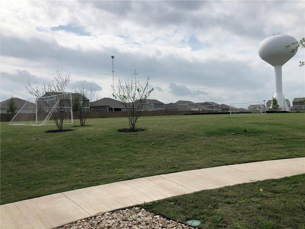 14120 Jeannette Rankin Rd Manor Manor, TX 78653 - Photo 23 of 25 View of property's community featuring an area for soccer and a residential view