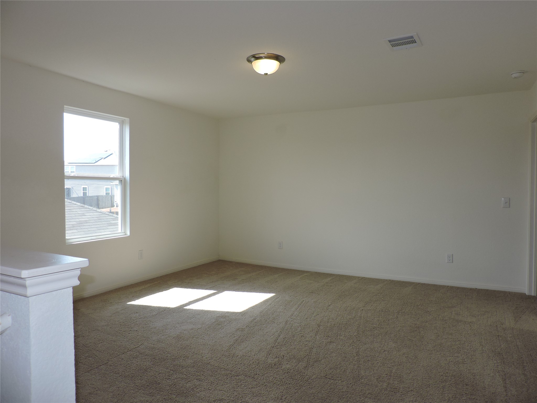14120 Jeannette Rankin Rd Manor Manor, TX 78653 - Photo 10 of 25 Unfurnished room with light carpet