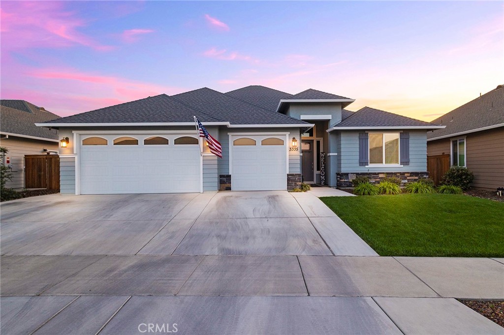 3335 Kettle Creek Chico, CA 95973 - Photo 1 of 1 a front view of a house with a yard and garage