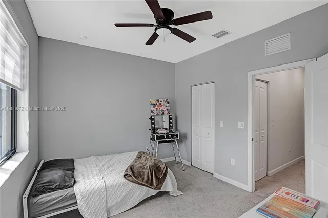 a bedroom with a bed and dresser
