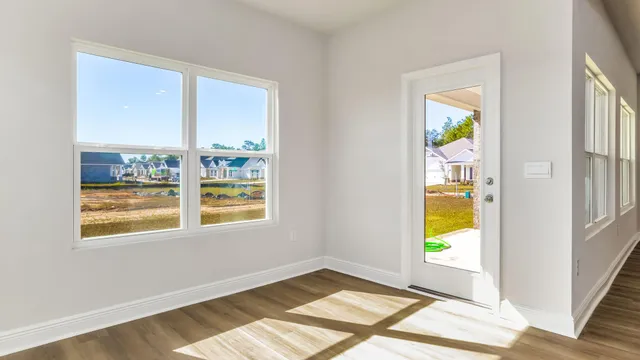a view of an empty room and a window