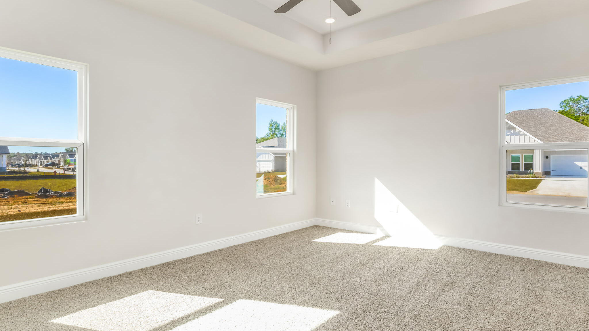 5622 Thatcher Road Crestview, FL 32539 - Photo 15 of 30 a view of a bedroom with wooden floor and windows