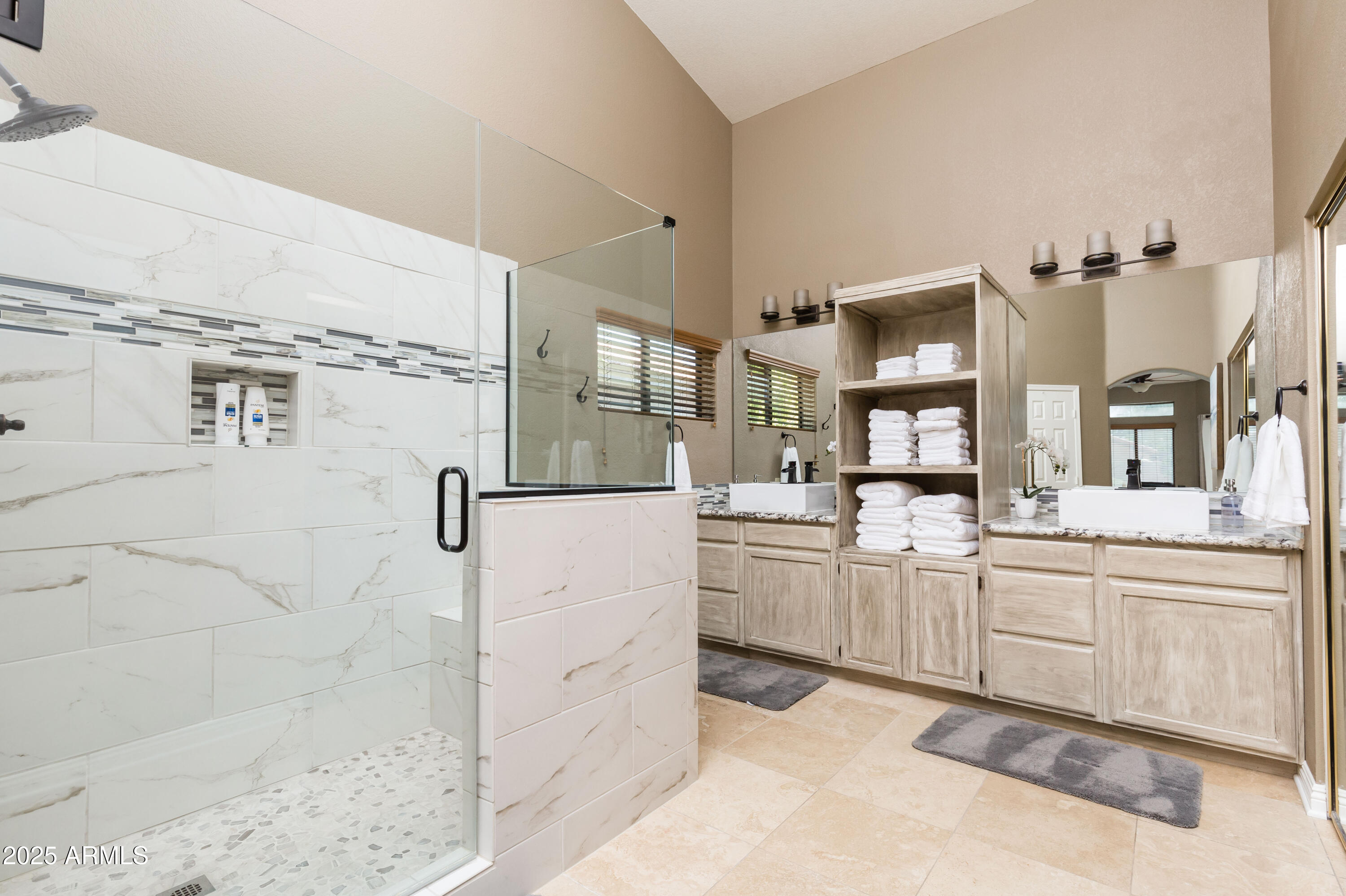 5821 East Aire Libre Avenue Scottsdale, AZ 85254 - Photo 17 of 35 a kitchen with stainless steel appliances kitchen island granite countertop a refrigerator and a sink
