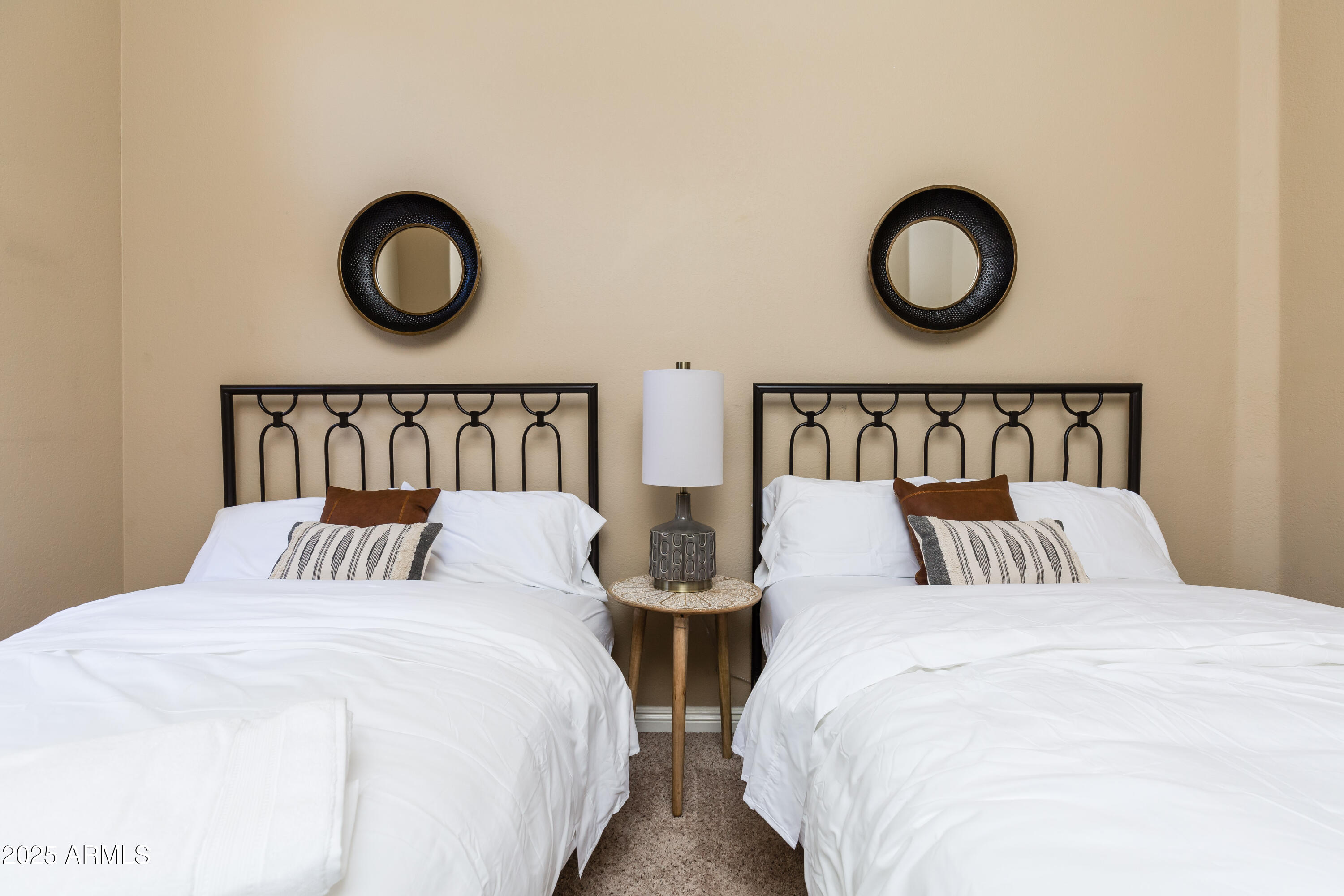 5821 East Aire Libre Avenue Scottsdale, AZ 85254 - Photo 19 of 35 a bedroom with two large bed and a bed